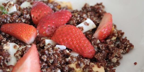 Image of a quinoa salad with strawberries and feta cheese.
