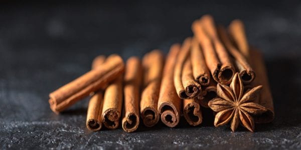 Cinnamon sticks against black backdrop