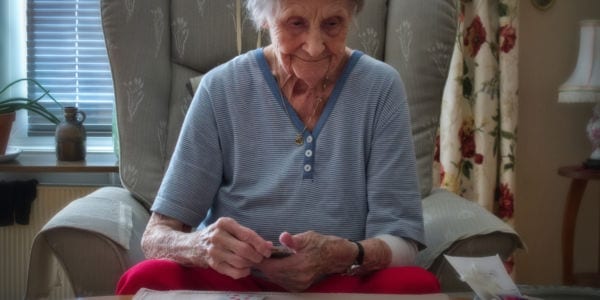 elderly woman playing solitaire