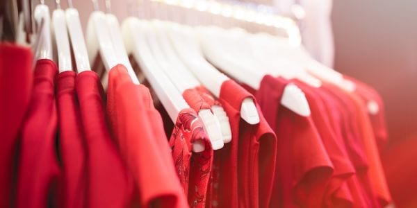Red clothing on hangers.