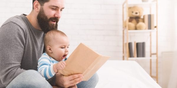 Dad reading to an infant
