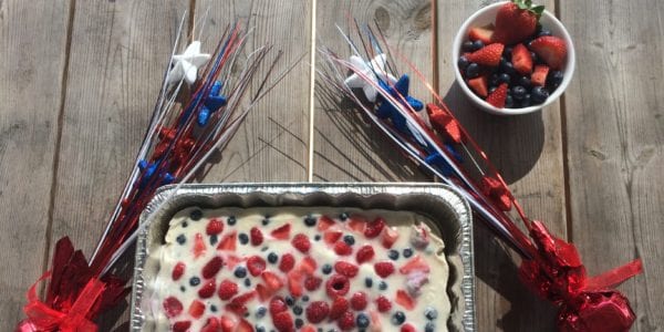 Yogurt bark and Fourth of July decorations on a wood table.