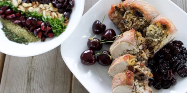 Cherry, Almond and Wild Rice Stuffed Pork Loin with grapes and a side dish