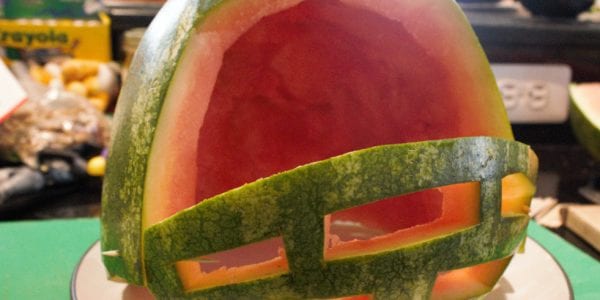 Warmelon cut in the shape of a football helmet