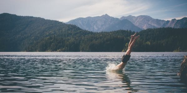 Man diving into lake