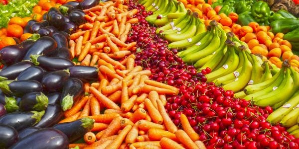 Large selection of fruits and vegetables at a market