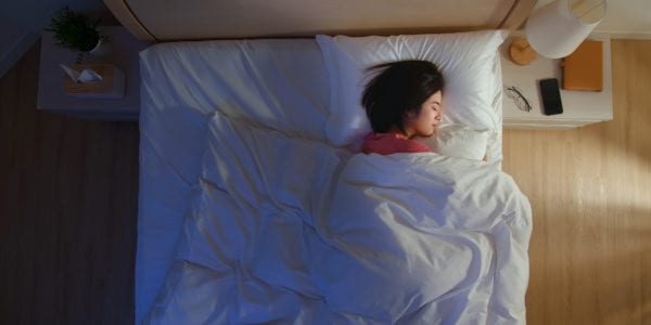 overlooking of asian woman sleep well with smile at night