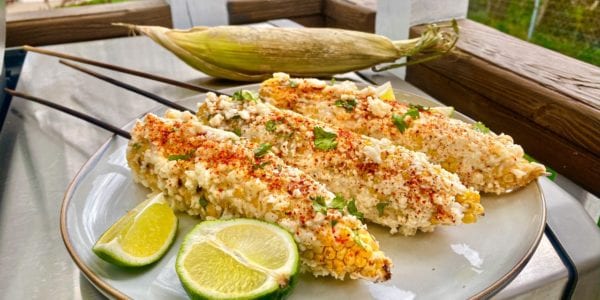 Elote, or street corn, is a staple food sold by Mexican street vendors.