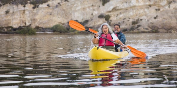 A beautiful senior Mexican couple kayaking