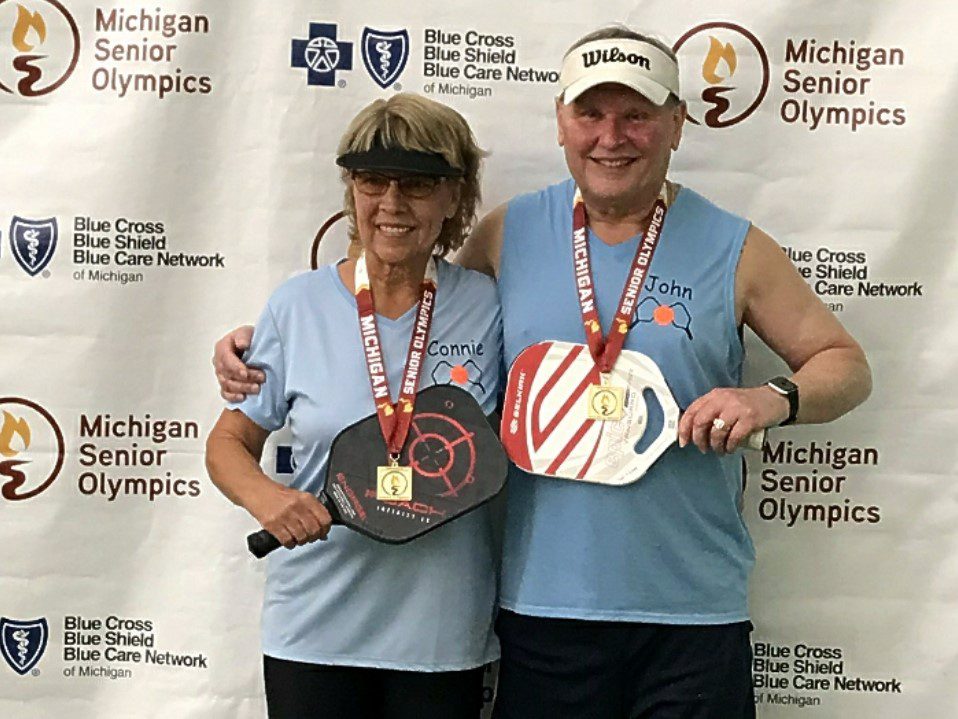 John Wilson, right, and his pickleball partner won gold in the March 2023 Michigan Senior Olympics.